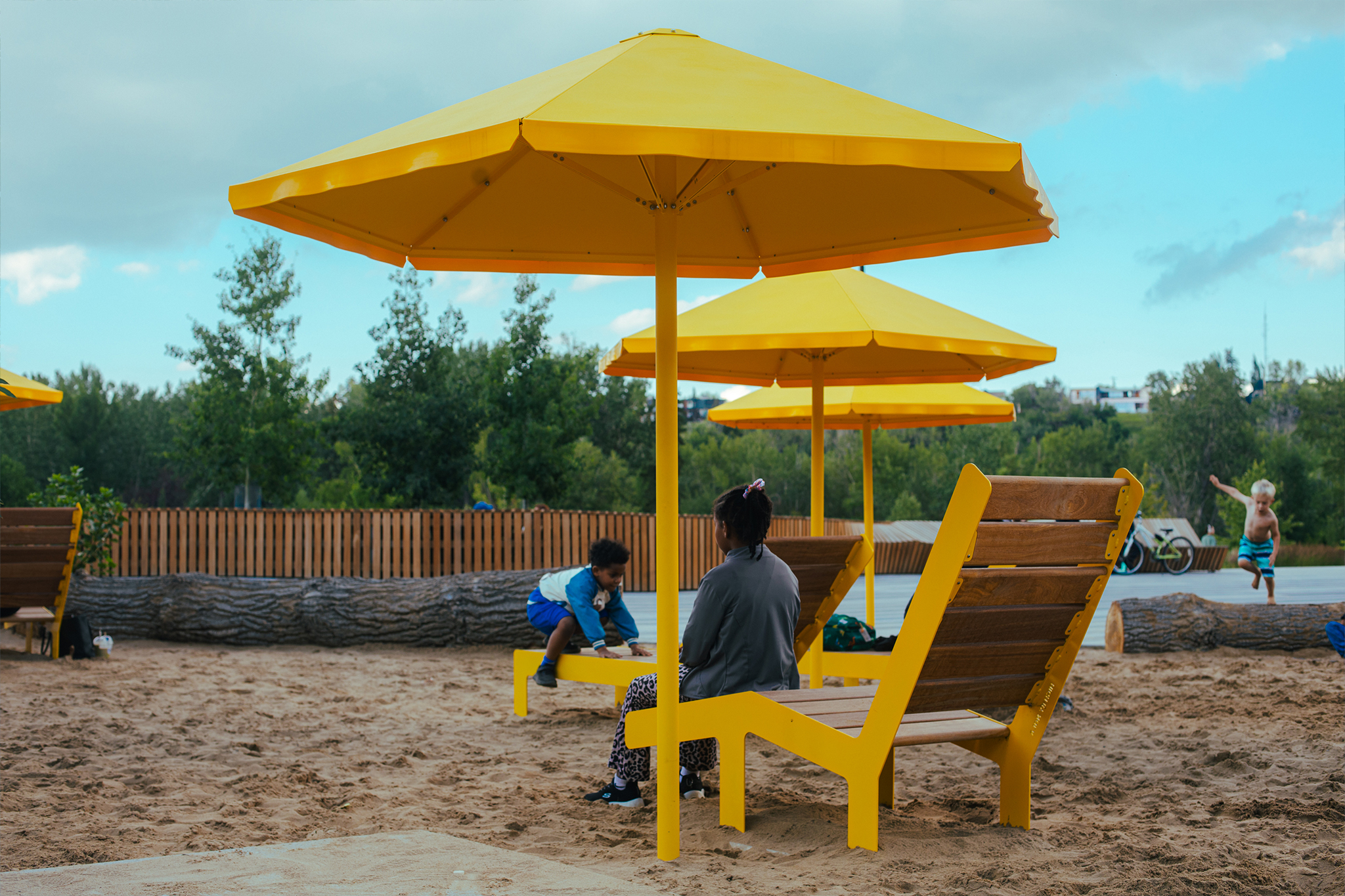 Eau Claire Plaza's beach area is designed for lounging and play.