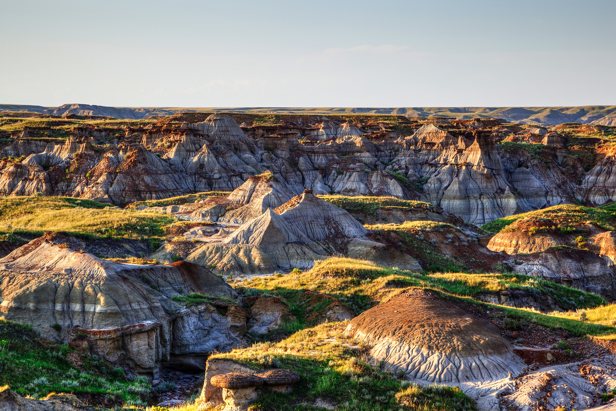 A photo of cracked, red earth at Dinosaur Provincial Park.